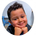 a young boy smiling
