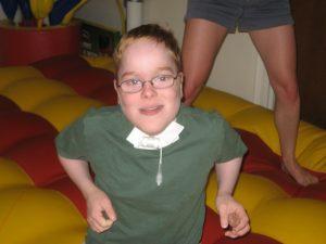 a young boy on a bouncy house